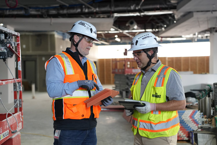 Two Nabholz employees in PPE talking